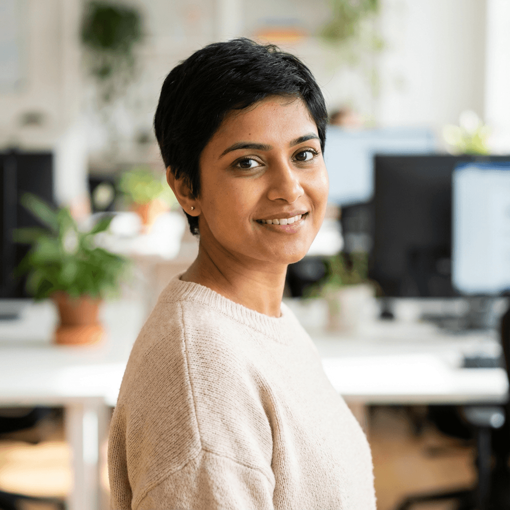 Female engineering lead in her mid 20s, smart casual, studio portrait